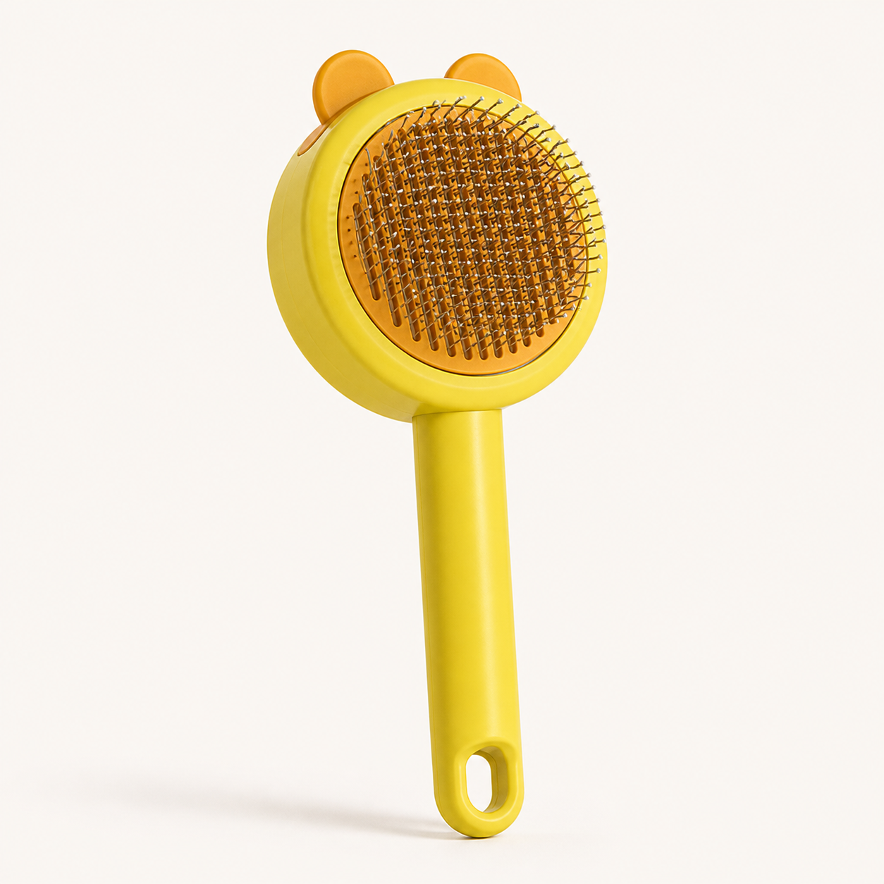 Yellow bear-shaped self-cleaning pet grooming pin brush